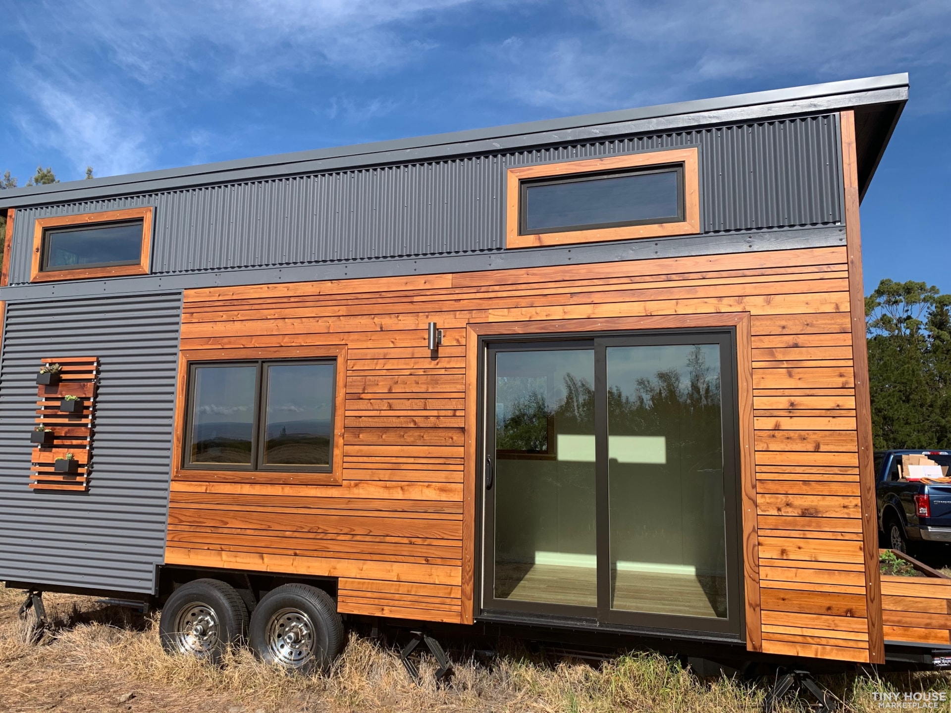 Omaha Model Tiny Home with wood and metal siding